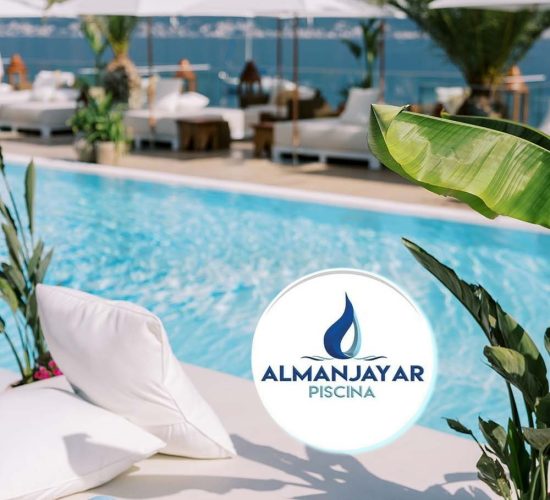 Row of glasses stands upside down on a table near a double sun lounger by the pool. High quality photo